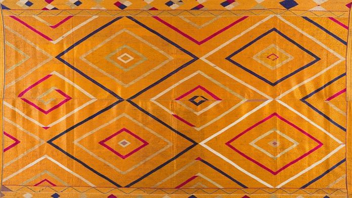 Vari Da Bagh with large colourful diamonds and smaller all-over self-design diamond pattern, Undivided Punjab, India, c. 1930s, Cotton, floss silk, 118 x 234 cm | Image courtesy of Museum of Art & Photography (MAP), Bengaluru.