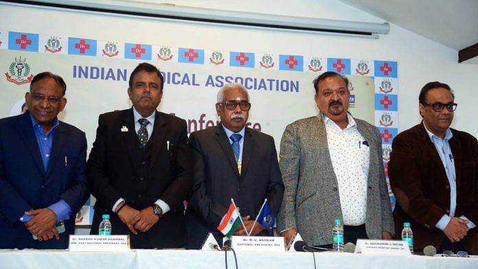 Indian Medical Association president R.V. Asokan with former president Sharad Kumar Agarwal and other officials during a press conference at the IMA headquarters in New Delhi last month | Photo: ANI
