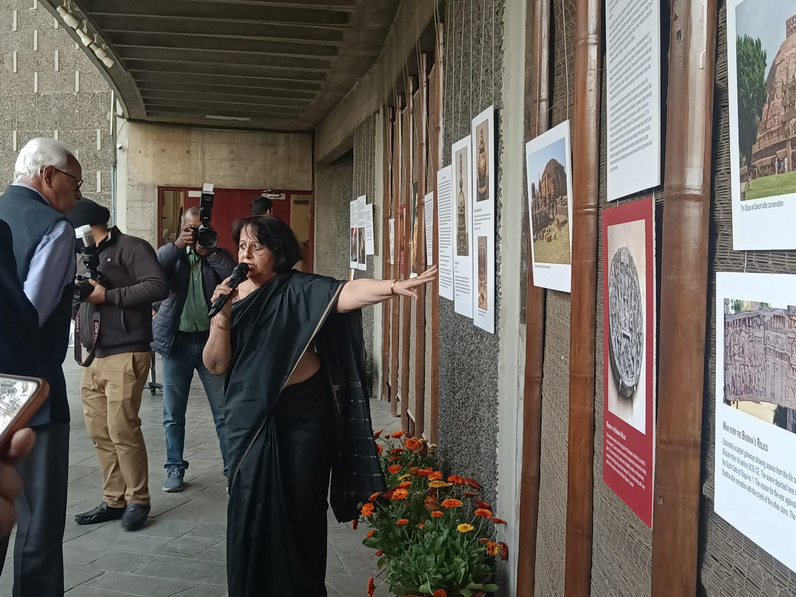 Historian and Archaeologist Himanshu Prabha Ray explaining the photos of the exhibition titled Travelling Relics: Spreading the Word of the Buddha | Krishan Murari, ThePrint