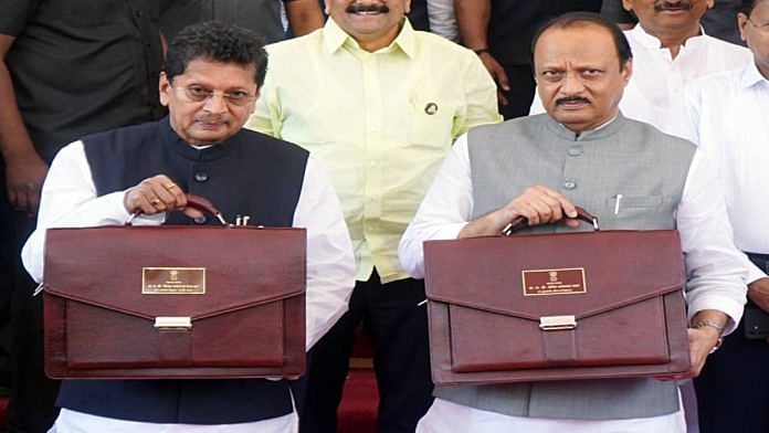 Maharashtra Deputy CM Ajit Pawar (right) and state minister Deepak Vasant Kesarkar with the state budget documents on 27 February | ANI