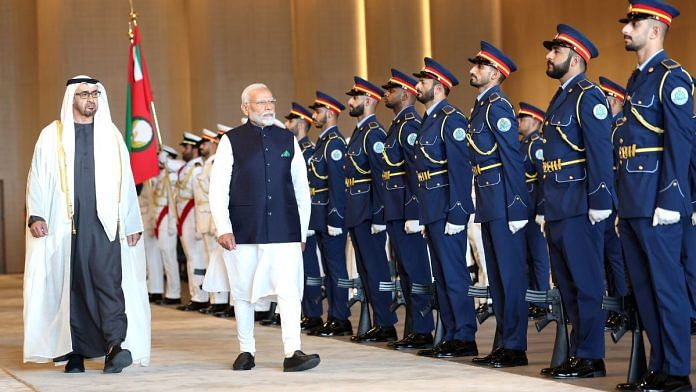 Prime Minister Narendra Modi inspects the guard of honour on his arrival in Abu Dhabi, UAE on Tuesday. UAE President Mohamed bin Zayed Al Nahyan also seen | ANI Photo