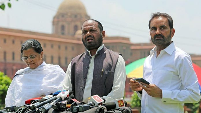 Congress Rajya Sabha MP Naranbhai J. Rathwa (centre) with party leaders Amee Yajnik and Shaktisinh Gohil addresses media over various issues in Gujarat, at Vijay Chowk Lawn, in New Delhi | ANI File Photo