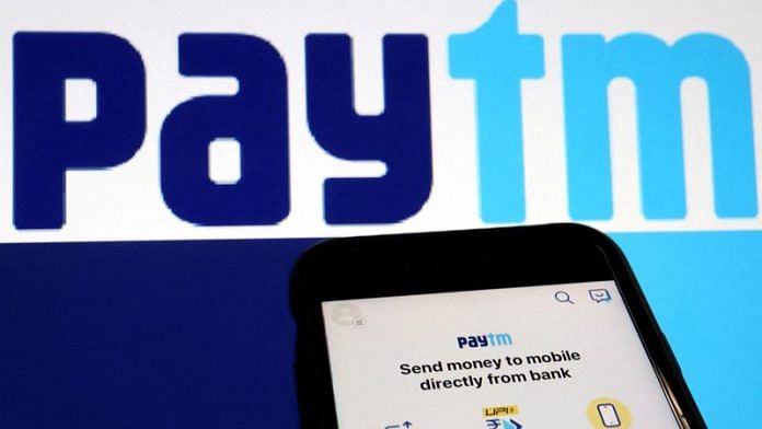 The interface of Indian payments app Paytm is seen in front of its logo displayed in this illustration picture taken July 7, 2021. REUTERS/Florence Lo/Illustration/File Photo