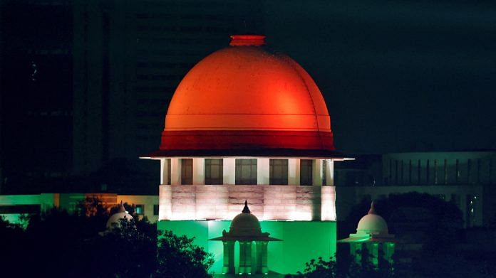 Illuminated Supreme Court building is pictured from the International Media Center during the G20 Summit in New Delhi, India, September 9, 2023 | Reuters