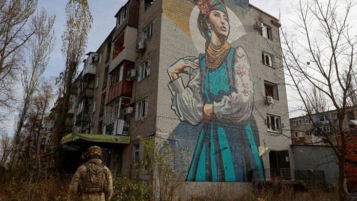 A Ukrainian serviceman walks next to a residential building heavily damaged by permanent Russian military strikes in the front line town of Avdiivka, amid Russia's attack on Ukraine, in Donetsk region, Ukraine November 8, 2023. Radio Free Europe/Radio Liberty/Serhii Nuzhnenko via REUTERS/File Photo