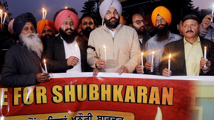 Congress MP Gurjeet Singh Aujla (3-R-in violet turban) along with members of various NGOs and social workers take part in a candlelight vigil for Shubhkaran Singh, a farmer who died at Khanauri border during the ongoing farmers' protest, in Amritsar | ANI