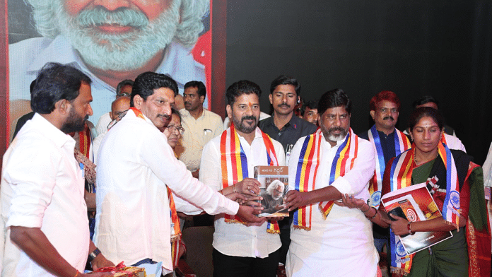 Telangana Chief Minister Revanth Reddy (centre) releases a book on renowned folk singer and balladeer Gaddar at a function, in Hyderabad on Wednesday | By Special Arrangement