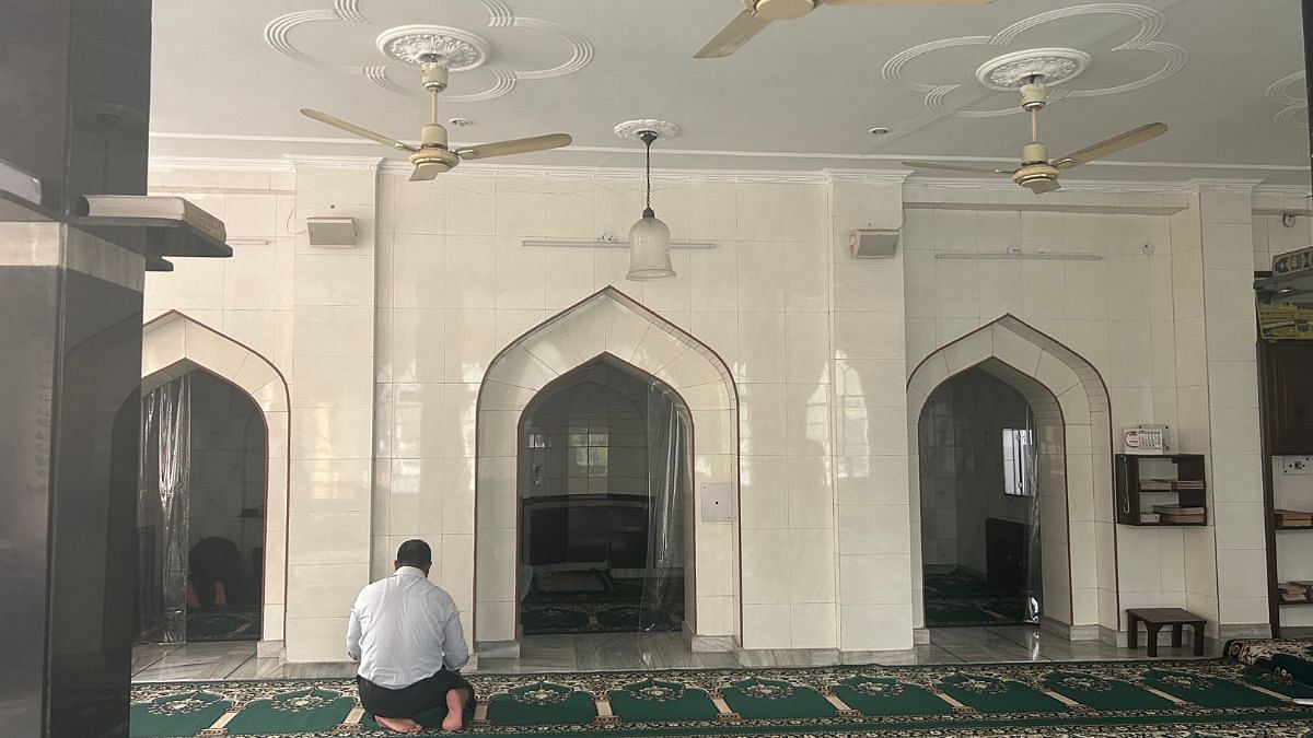 A devotee offering prayers at Sunehri Bagh Masjid | Zenaira Bakhsh, ThePrint