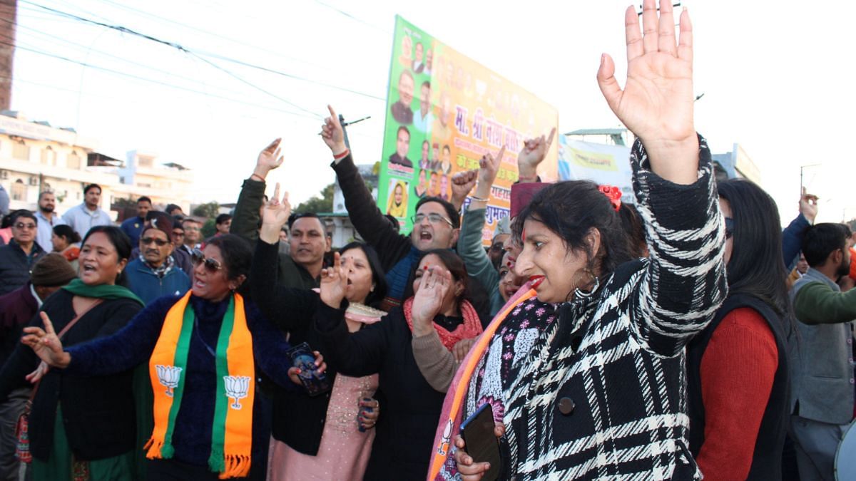 BJP workers dancing and chanting 'Jai Shri Ram,' 'Bharat Mata Ki Jai,' and 'Dhami Dhami' outside the Uttarakhand Vidhansabha on 7 February | Photo: Heena Fatima | ThePrint