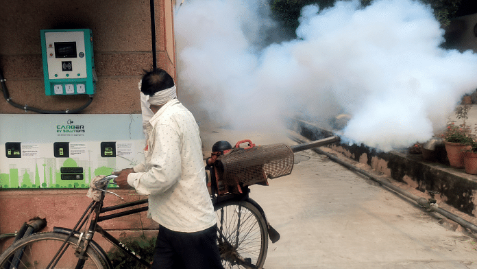 A file photo of a worker fumigating the locality at IP Extension in Delhi last year in the wake of a rise in dengue cases | ANI