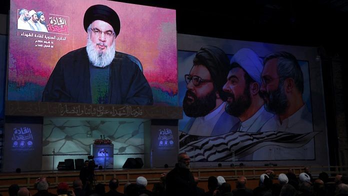 Lebanon's Hezbollah leader Sayyed Hassan Nasrallah appears on a screen as he gives a televised address during a rally commemorating the group's late leaders in Beirut's southern suburbs, Lebanon February 16, 2024 | Representational image | Reuters