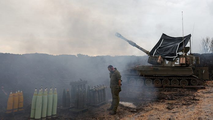An Israeli soldier stands by a mobile artillery unit, near the Israel-Lebanon border, in northern Israel January 15, 2024 | Reuters