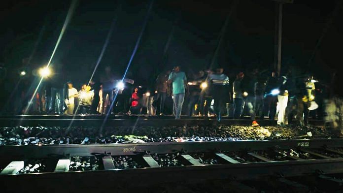 People stand near a railway track where at least two persons were run over and killed by a train near Kaljharia area, in Jamtara district, Wednesday, Feb. 28, 2024 | PTI