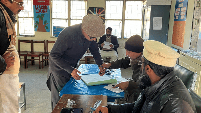 Businessman Imran Sheikh, 52, registers to vote at a polling station in a school on the day of the general election, in Islamabad, Pakistan Thursday | REUTERS/Ariba Shahid