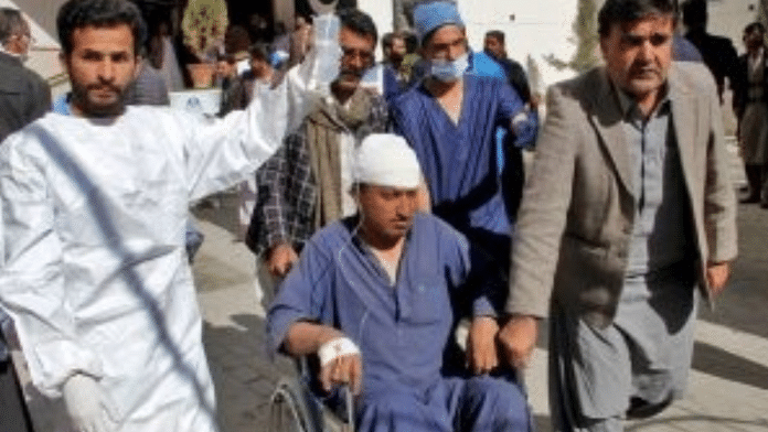 A man, who was injured in a blast in Khanozai, leaves hospital after receiving treatment in Quetta, Pakistan, February 7, 2024 | Reuters
