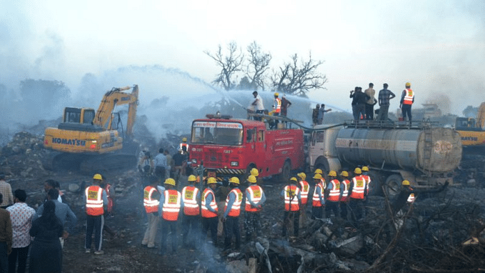 Rescue members from State Disaster Response Force (SDRF) douse the smoldering debris following a blast in a firecracker factory in Harda, Madhya Pradesh, India, February 6, 2024 | Reuters