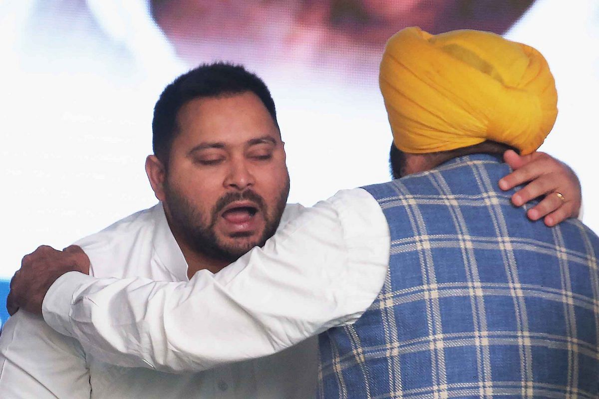 RJD's Tejashwi Yadav hugs Punjab CM Bhagwant Mann | Photo: Praveen Jain | ThePrint