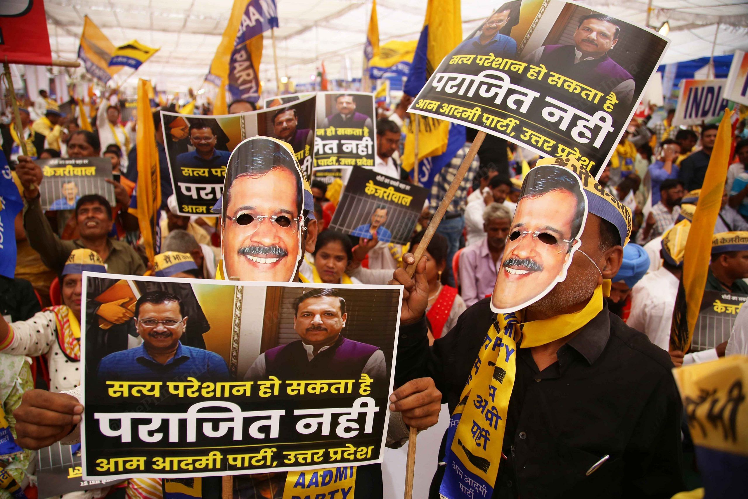 Crowd wear Kejriwal masks at the rally | Photo: Manisha Mondal | ThePrint