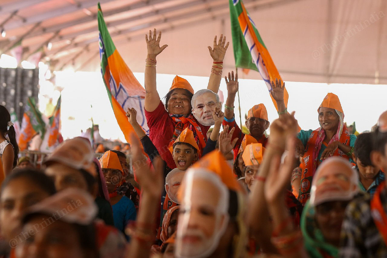Womens suppoters wearing Modi face mask during a rally | Photo Suraj Singh Bisht, ThePrint