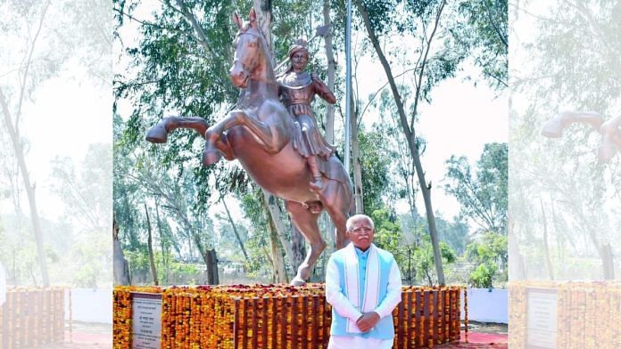 Haryana Chief Minister Manohar Lal Khattar poses in front of the statue of Raja Hasan Khan Mewati | By special arrangement