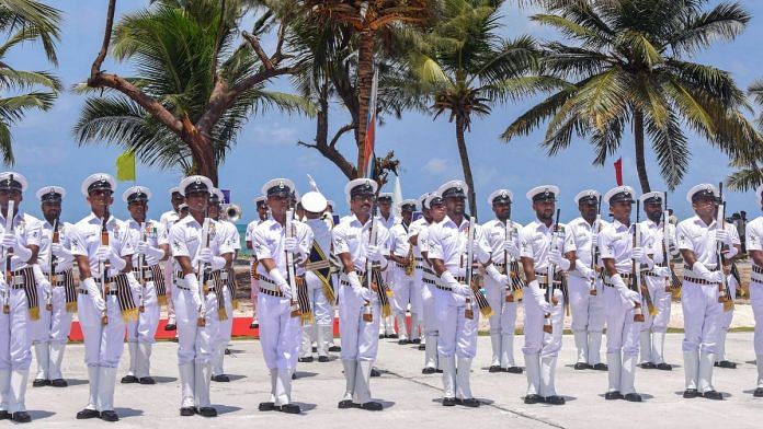 Indian Naval officers march past during the commissioning of naval base 'INS Jatayu', in Minicoy, Lakshadweep Islands, Wednesday | PTI Photo