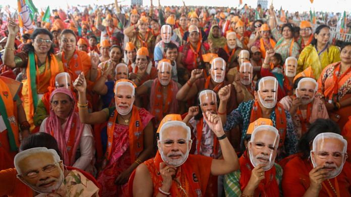 Supporters at a rally addressed by Prime Minister Narendra Modi in Meerut Sunday | Suraj Singh Bisht | ThePrint