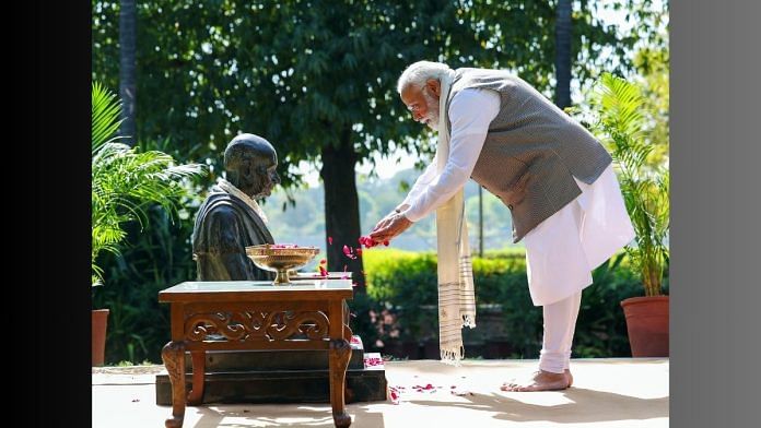Prime Minister Narendra Modi offers floral tributes to Mahatma Gandhi at Mahatma Gandhi Ashram at Sabarmati, in Ahmedabad on Tuesday | ANI Photo