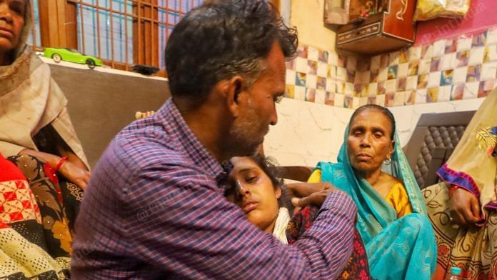 Sangeeta Devi and Vinod Kumar, the parents of the murdered children, at their house in Budaun's Baba colony Wednesday | Manisha Mondal | ThePrint