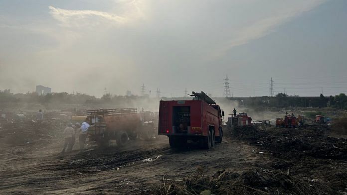 Efforts to separate burning waste continue at Sector 32 Noida dumping yard, which caught fire on Holi | Zenaira Bakhsh | ThePrint