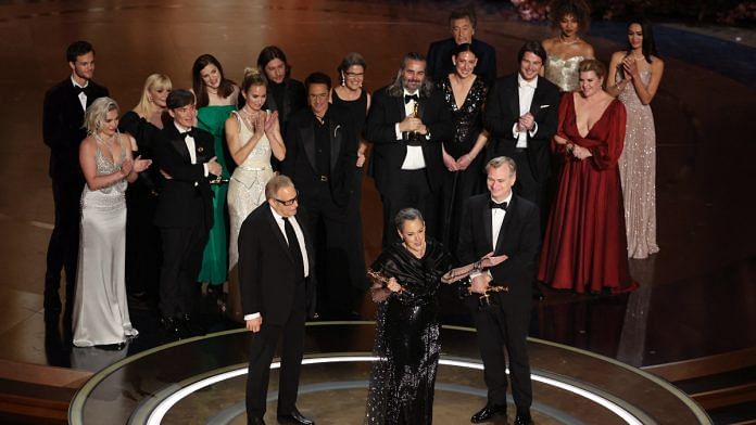 Director Christopher Nolan and Producers Emma Thomas and Charles Roven win the Oscar for Best Picture for 