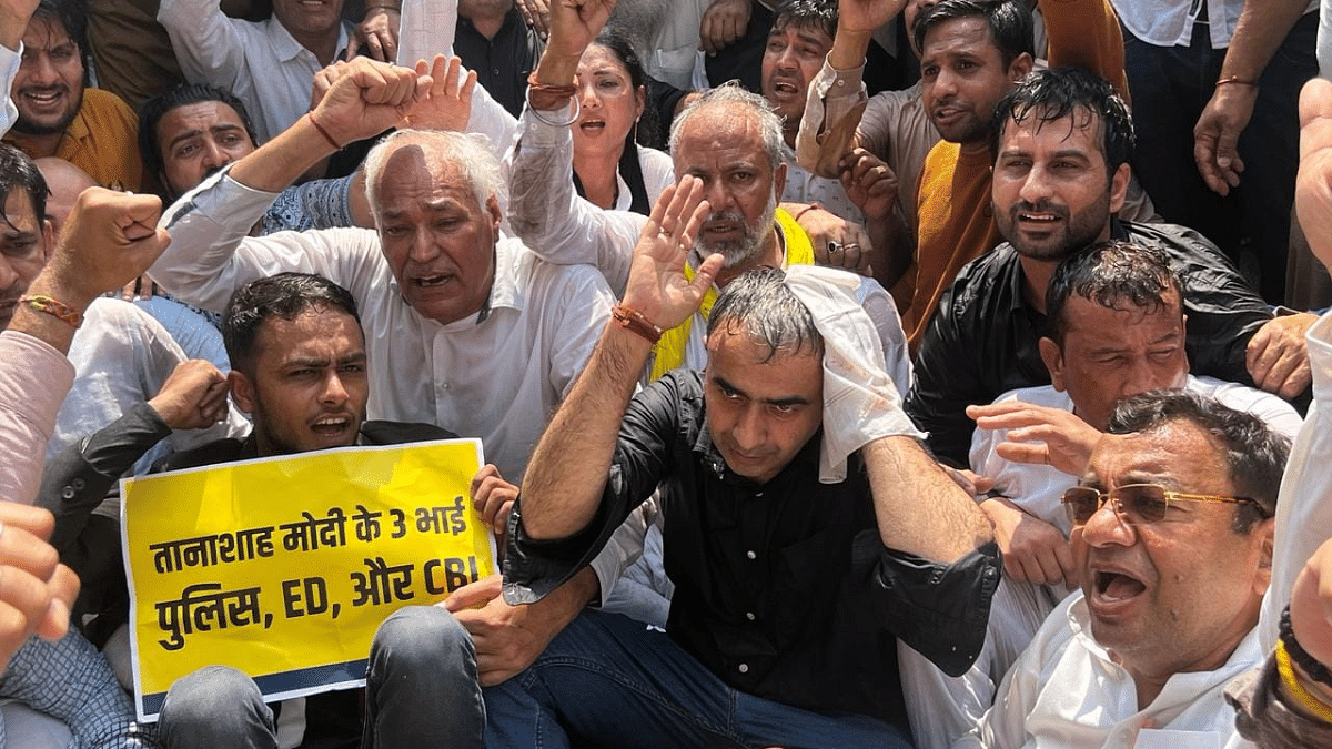 Senior vice-president of AAP Haryana, Anurag Dhanda protesting along other party workers outside CM Nayab Singh Saini's residence | AAP/Facebook
