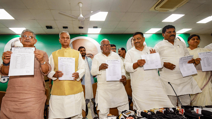 Janata Dal-United (JD-U) senior leader Bashistha Narain Singh with party leaders Lalan Singh, Umesh Kushwaha and others releases party candidates' list for upcoming Lok Sabha elections, in Patna, March 24, 2024 | PTI