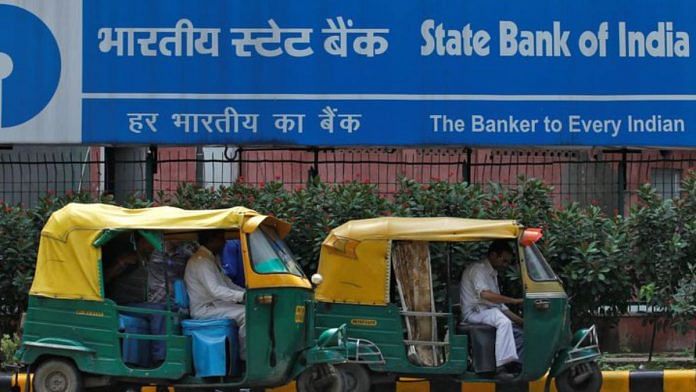 Auto rickshaws wait in front of the head office of State Bank of India (SBI) in New Delhi | File Photo: Reuters