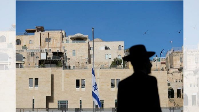 Jewish man near the Israeli national flag | Reuters