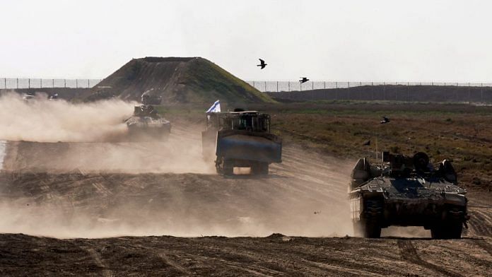 Military vehicles manoeuvre near the Israel-Gaza border fence, amid the ongoing conflict between Israel and the Palestinian Islamist group Hamas, in Israel, March 4, 2024 | Representative image | Reuters/Ammar Awad
