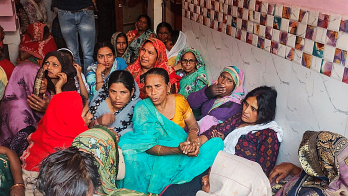 Family members and relatives mourn after two boys were killed by a local barber on Tuesday in Budaun | PTI