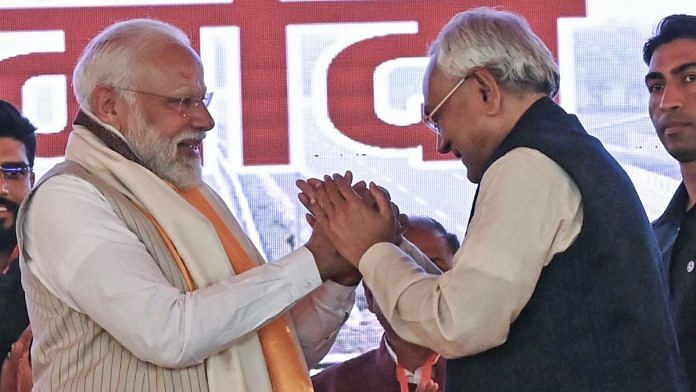 Prime Minister Narendra Modi being greeted by Bihar Chief Minister Nitish Kumar during the inauguration and laying of the foundation stone of multiple development projects worth more than Rs 21,400 crore in the state, in Aurangabad on Saturday. (ANI Photo)