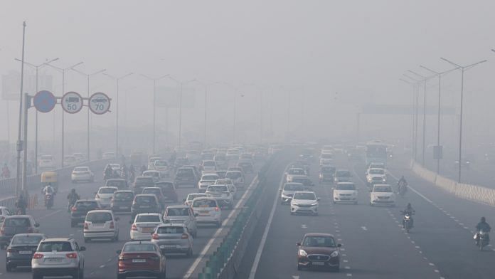 Traffic moves along a highway shrouded in heavy smog in New Delhi, India, December 26, 2023 | Reuters file photo