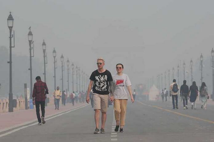 Foreigners stroll in Delhi, surrounded by the haze of pollution | File photo | Photo: Suraj Singh Bisht | ThePrint