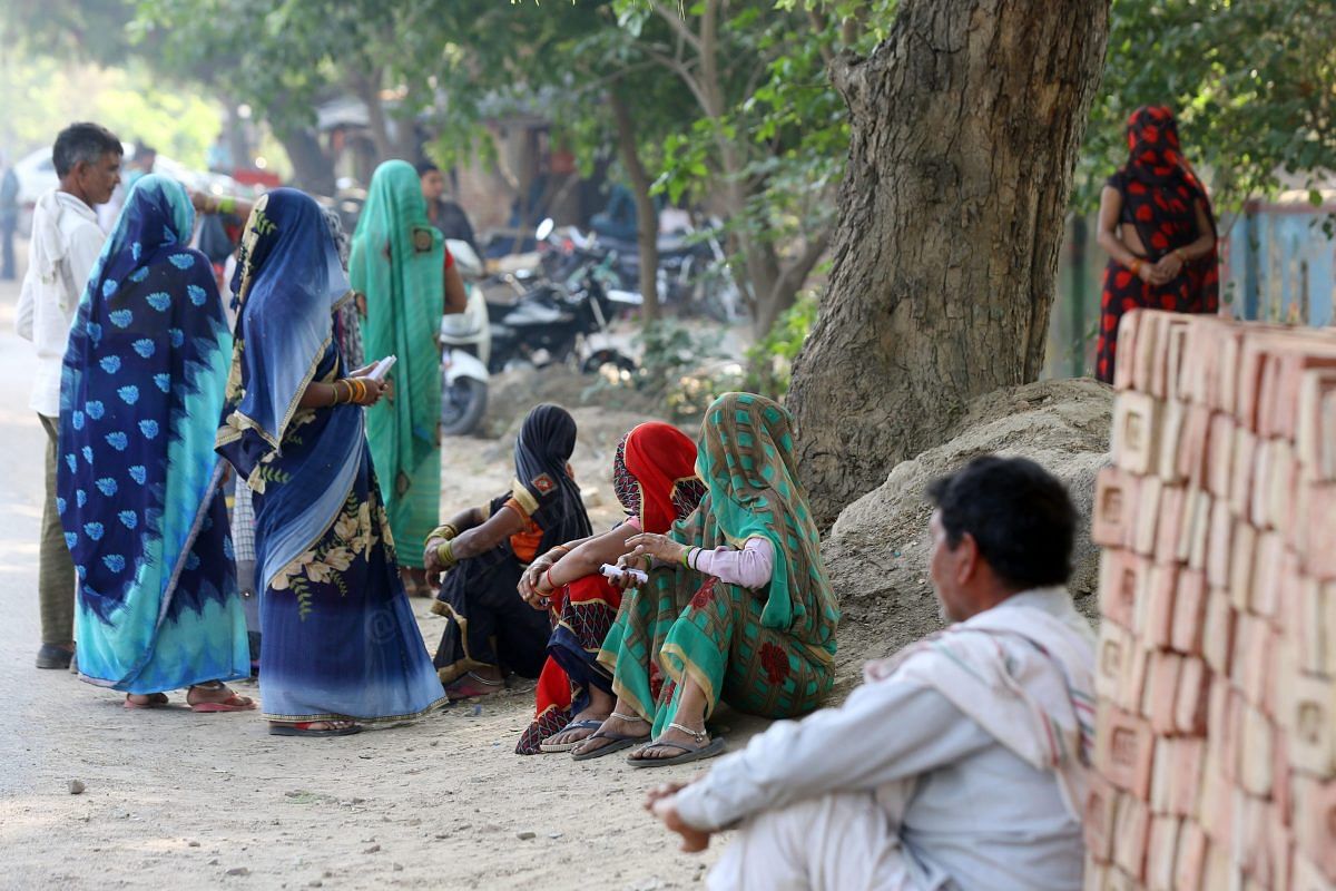 People wait outside polling station in Mathura | Suraj Singh Bisht | ThePrint