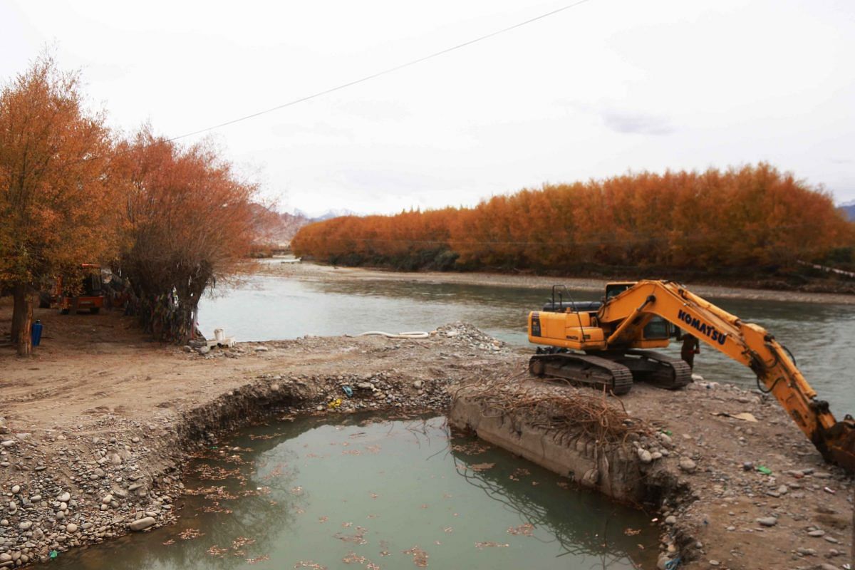 A bulldozer alongside a river basin in Ladakh, in October 2021 | Manisha Mondal| ThePrint