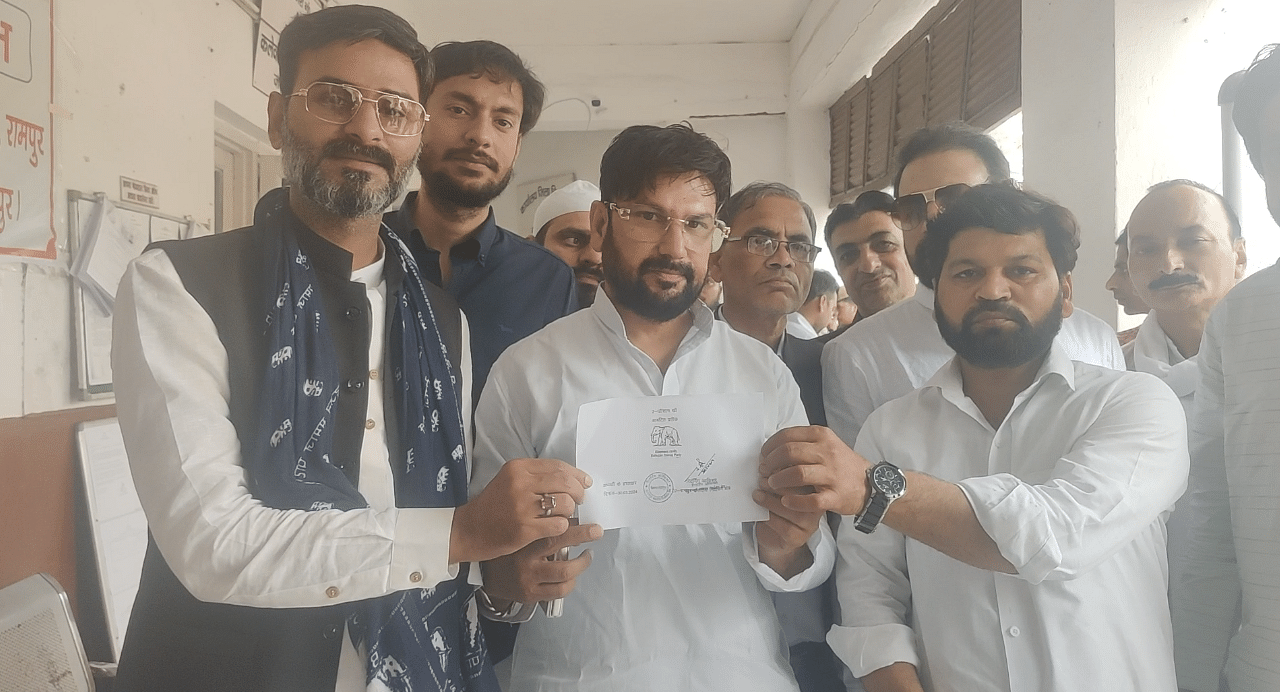 Rampur's BSP candidate Zeeshan Khan (wearing a blue scarf) poses for a photo. Rampur's Muslim residents fear a division of votes between him and Nadvi | Heena Fatima | ThePrint