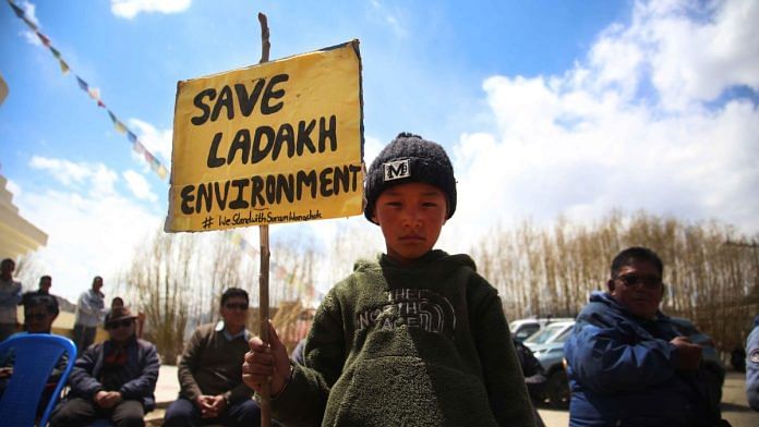 A child holds a placard at protest site in Leh | Manisha Mondal | ThePrint