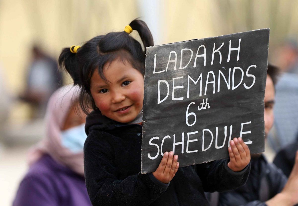 A child carrying a placard highlighting demand for Ladakh to be included in Sixth Schedule | Manisha Mondal | ThePrint
