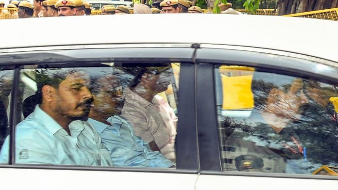 File photo of Delhi CM Arvind Kejriwal being taken to Rouse Avenue court | Representational image | ANI