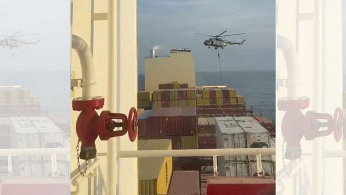 An official slides down a rope during a helicopter raid on MSC Aries ship at sea in this screen grab obtained from a social media video released on 13 April, 2024 | Credit: Video obtained by Reuters/via REUTERS