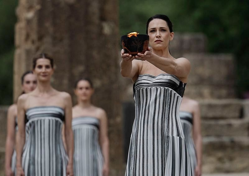 OlympicsParis 2024 torch lit in ancient Olympia, relay under way