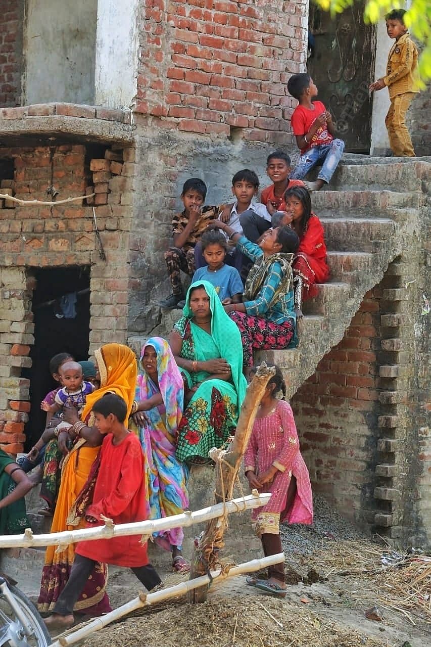 Women voters take up terraces, stairs while waiting for Smriti Irani | Photo: Praveen Jain \ ThePrint