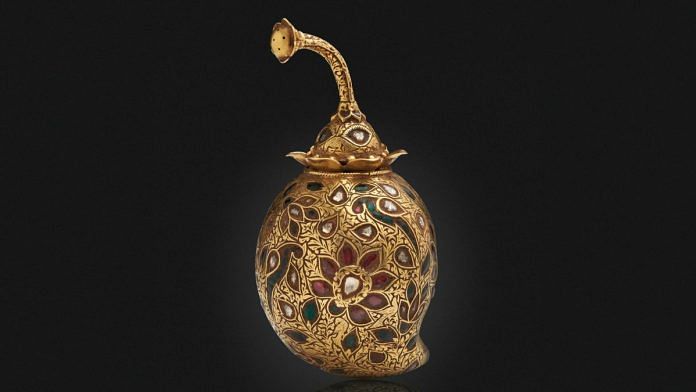 A Mango-shaped Carved and Gem Set Gold Perfume Flask, North India, c. 1770-1740, Diamonds, rubies and emeralds, 9.1 x 4.5 x 4.7 cm, Image courtesy of Christie's.