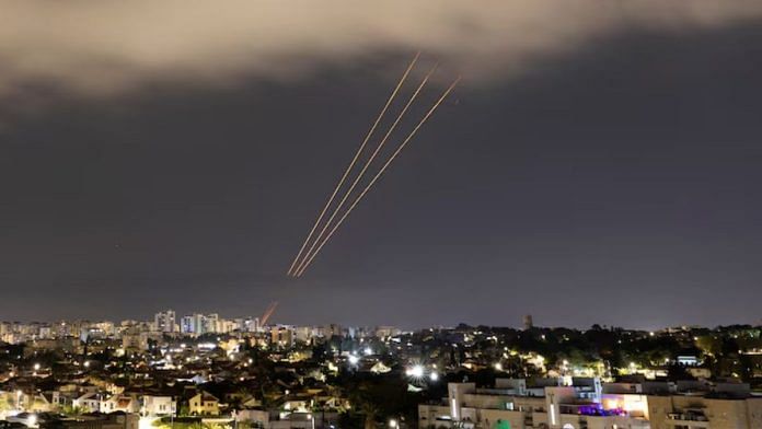 An anti-missile system operates after Iran launched drones and missiles towards Israel, as seen from Ashkelon, Israel April 14, 2024 | Credit: REUTERS/Amir Cohen